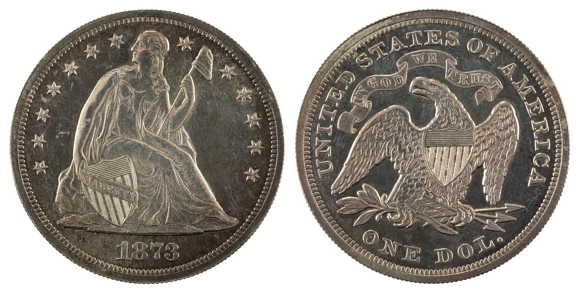 1873 Seated Liberty dollar with motto, obverse and reverse. National Numismatic Collection.
